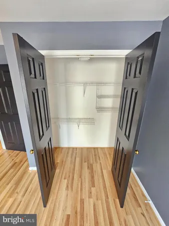 a view of a hardwood floor in an empty room