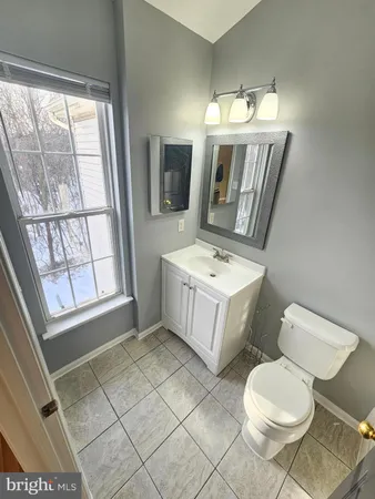 a bathroom with a toilet and a bathtub