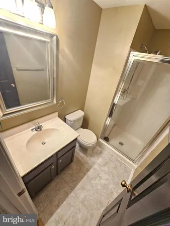 a bathroom with a toilet and shower