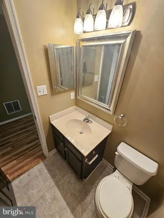 a view of a room with wooden floor and staircase