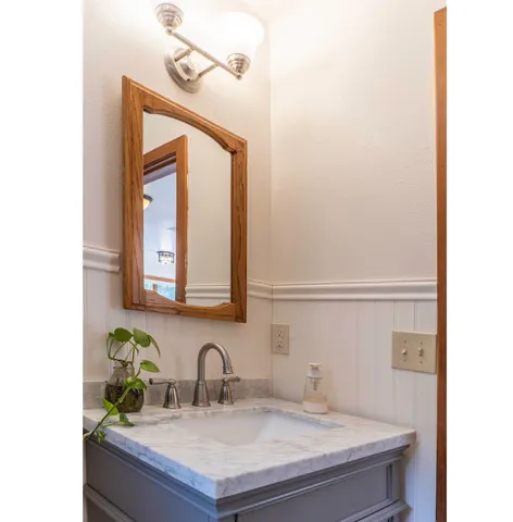 a bathroom with a sink and a mirror