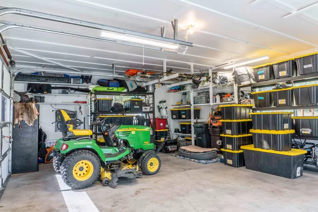 a view of garage with a wooden fence