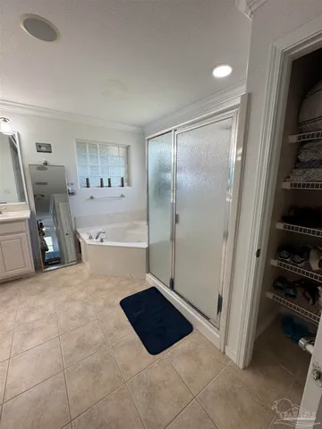 a bathroom with a tub and a shower