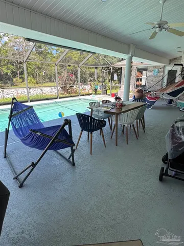 a view of a dining room with furniture window and outside view