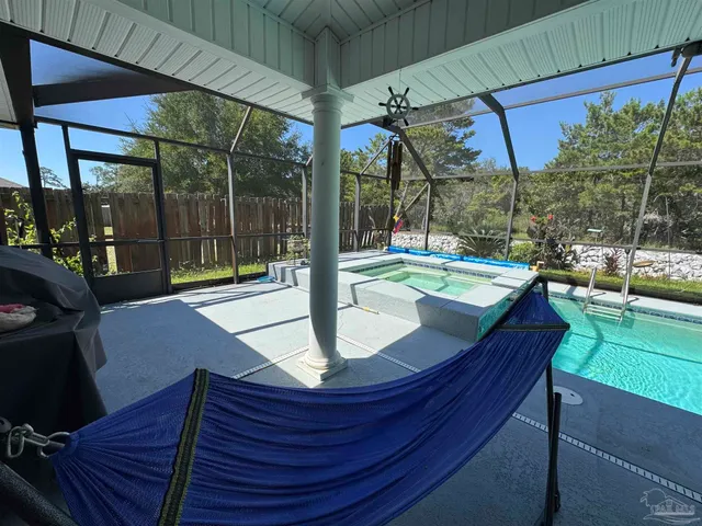 a view of swimming pool with a patio