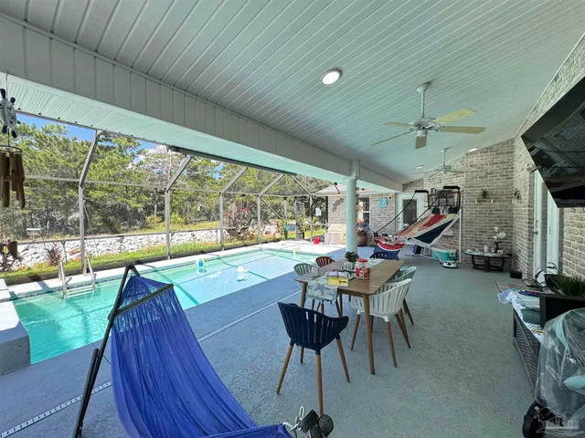 a outdoor dining space with furniture and garden view