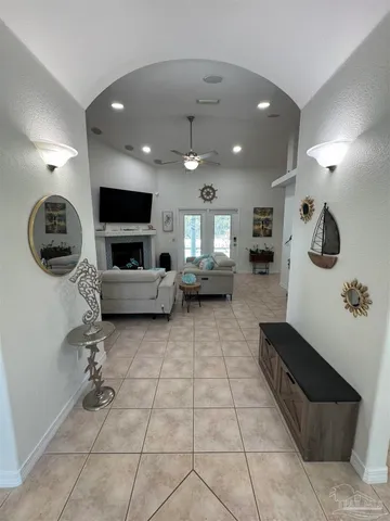 a lobby with furniture and a mirror