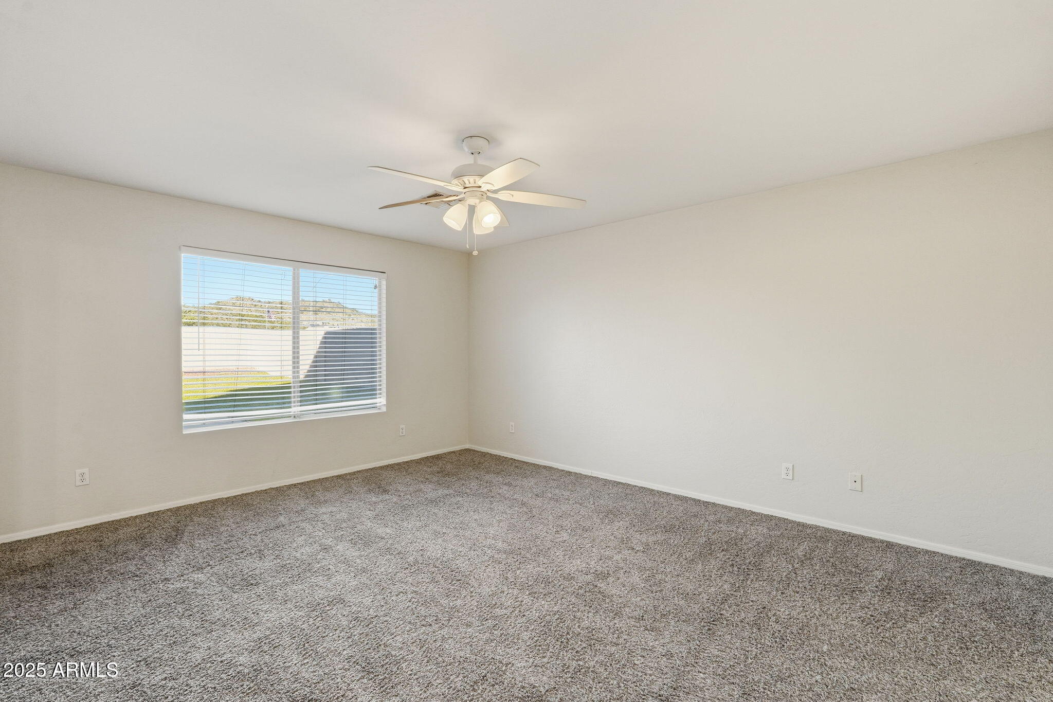 6782 West Rowel Road Peoria, AZ 85383 - Photo 18 of 42 an empty room with a window