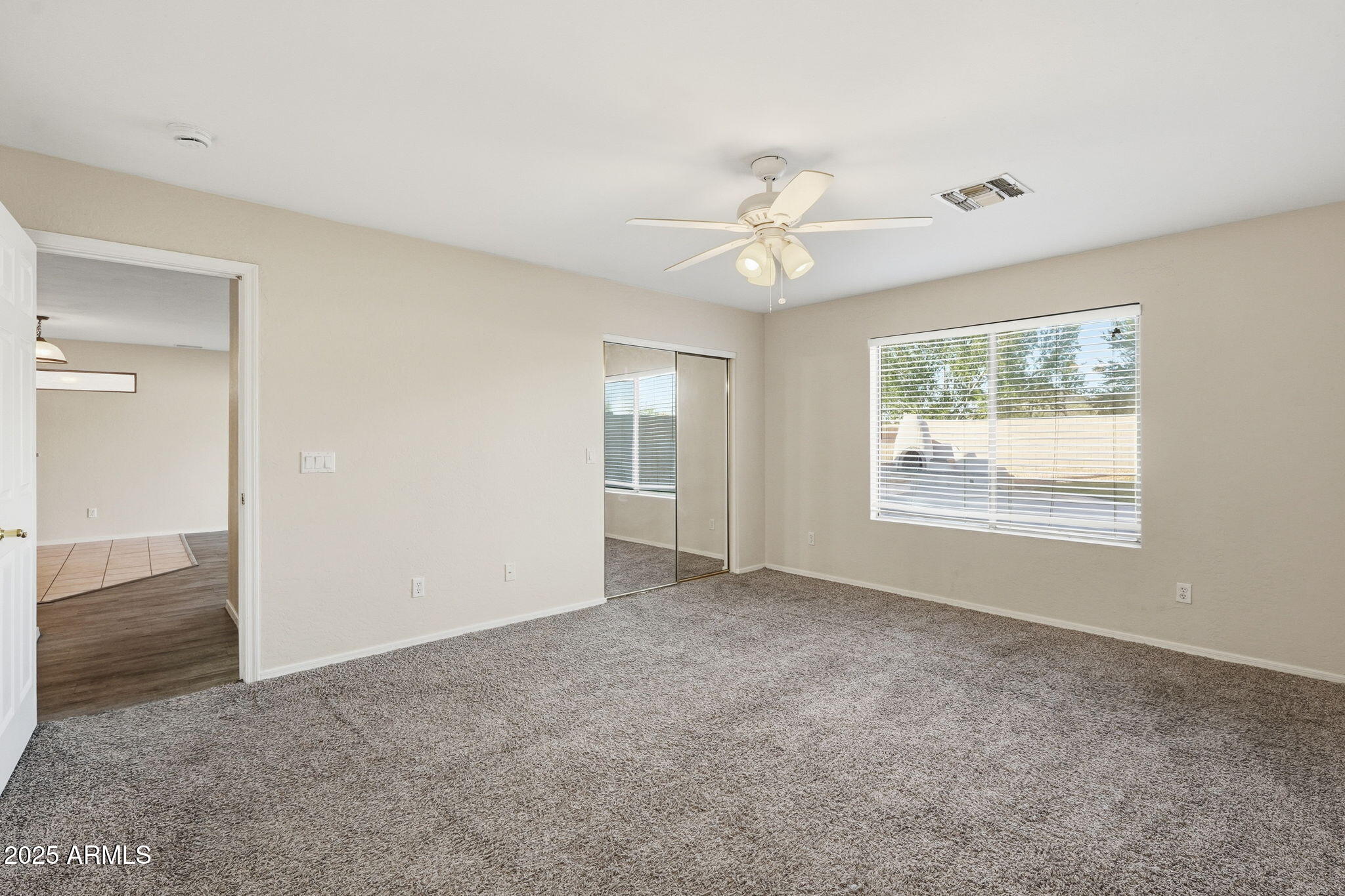 6782 West Rowel Road Peoria, AZ 85383 - Photo 19 of 42 a view of an empty room with a window