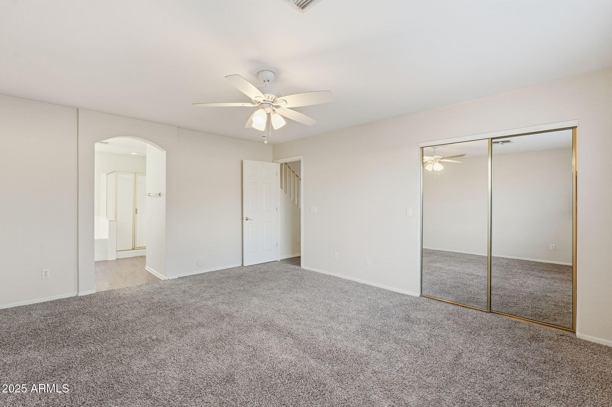 6782 West Rowel Road Peoria, AZ 85383 - Photo 20 of 42 a view of an empty room with a fan