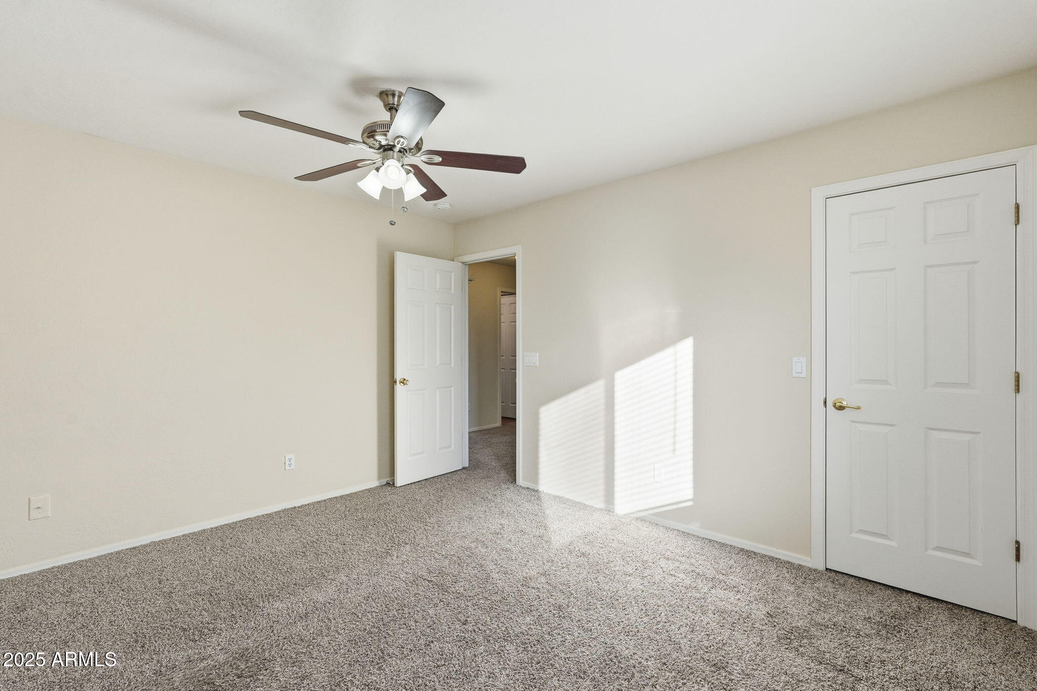 6782 West Rowel Road Peoria, AZ 85383 - Photo 23 of 42 a view of an empty room and a ceiling fan