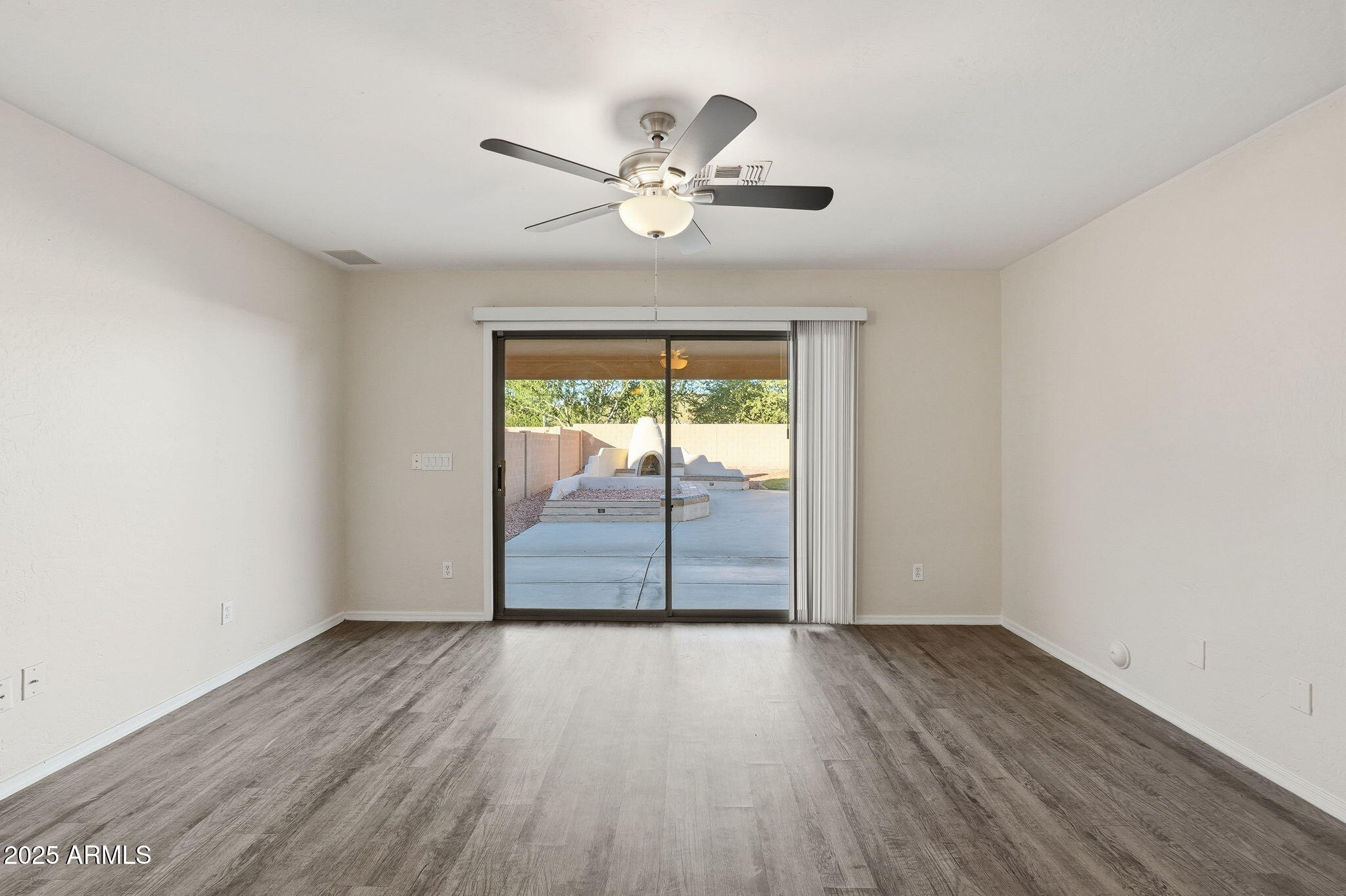 6782 West Rowel Road Peoria, AZ 85383 - Photo 6 of 42 wooden floor in an empty room with a window