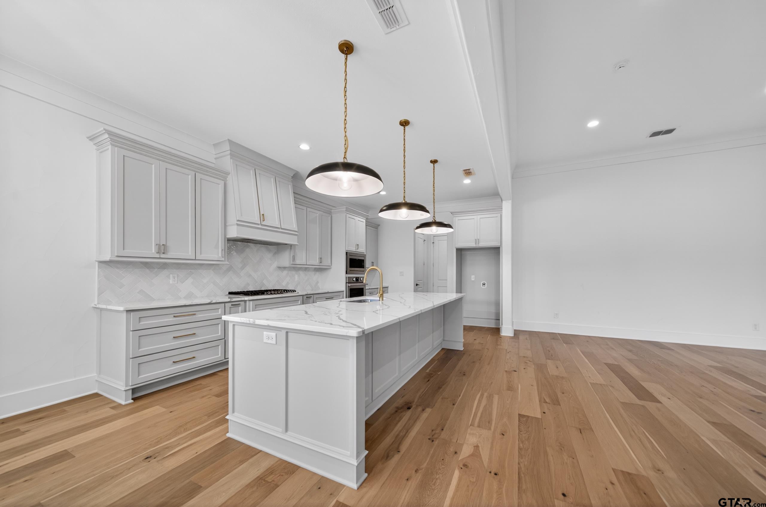 7517 Cross Gate Way Tyler, TX 75703 - Photo 36 of 47 a kitchen with a sink stainless steel appliances and cabinets