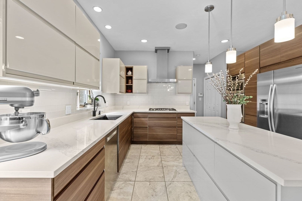 5 Sullivan Way Canton, MA 02021 - Photo 12 of 40 a large kitchen with kitchen island a sink stainless steel appliances and cabinets