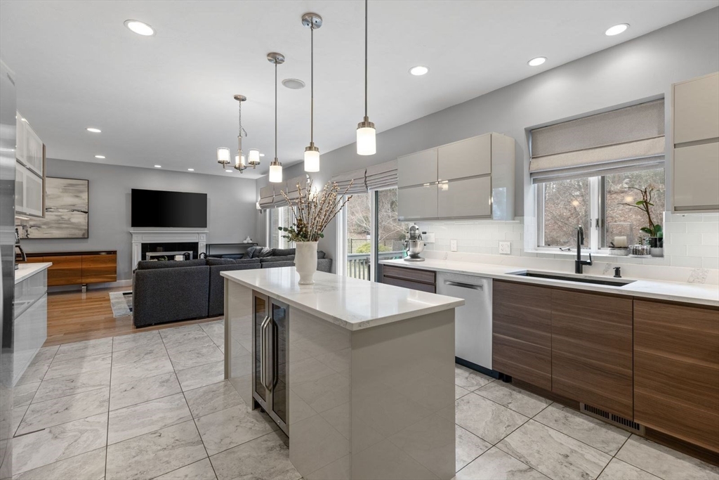 5 Sullivan Way Canton, MA 02021 - Photo 16 of 40 a kitchen with a sink a counter top space appliances and cabinets