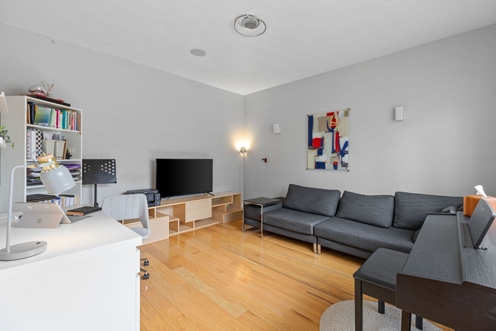 5 Sullivan Way Canton, MA 02021 - Photo 18 of 40 a living room with furniture and a flat screen tv