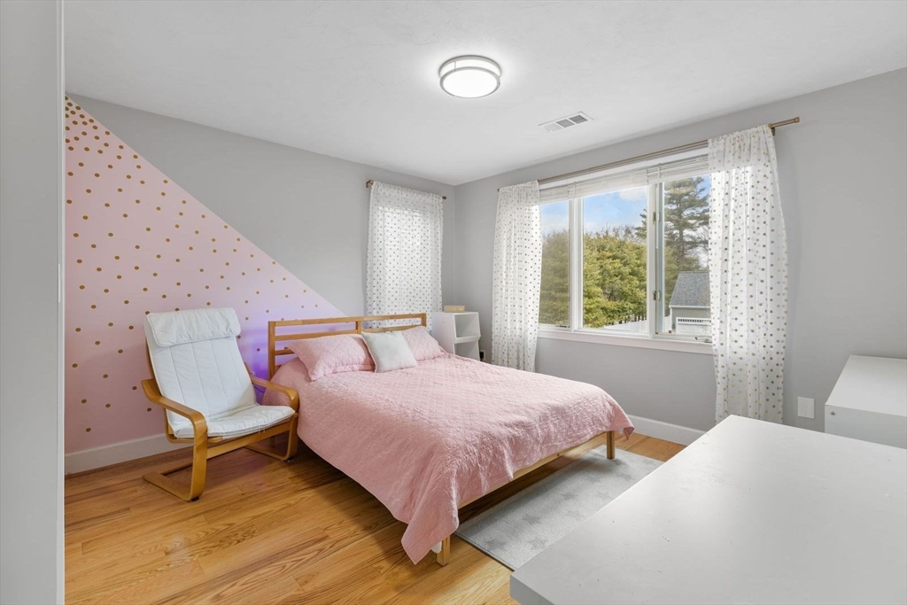 5 Sullivan Way Canton, MA 02021 - Photo 20 of 40 a bedroom with a bed and a window