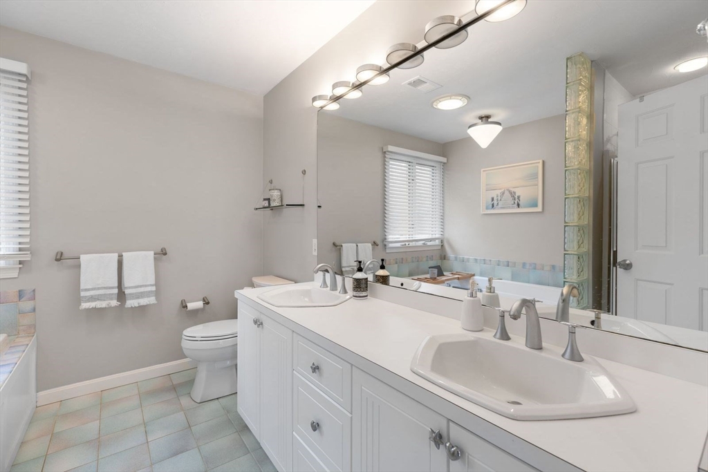 5 Sullivan Way Canton, MA 02021 - Photo 27 of 40 a bathroom with a double vanity sink mirror and toilet