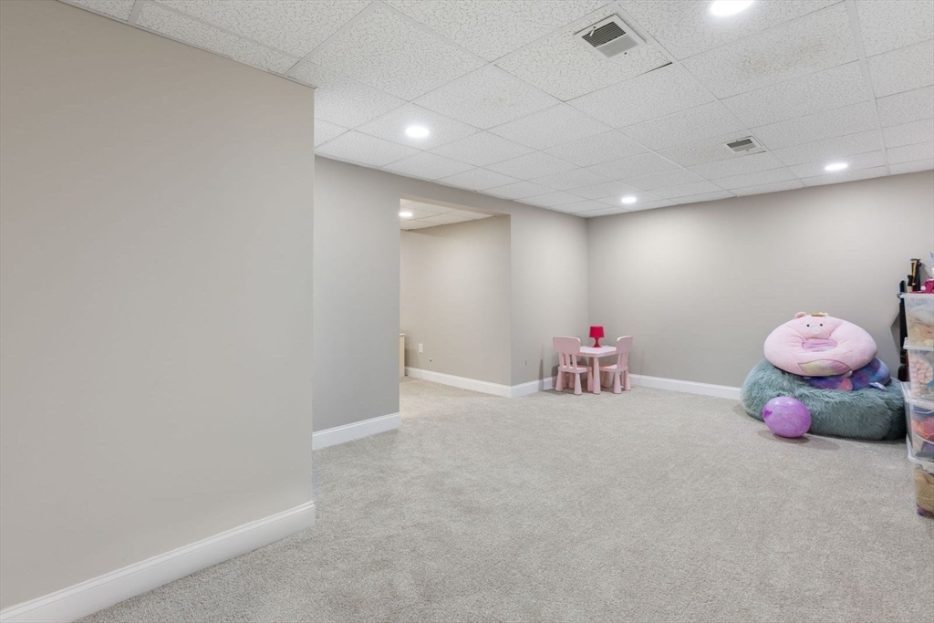 5 Sullivan Way Canton, MA 02021 - Photo 30 of 40 a group of people sitting in a room