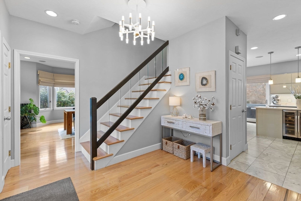 5 Sullivan Way Canton, MA 02021 - Photo 3 of 40 a view of a livingroom with furniture staircase and a kitchen