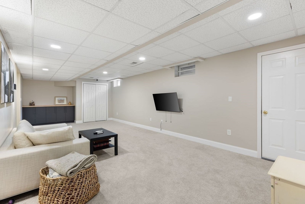 5 Sullivan Way Canton, MA 02021 - Photo 32 of 40 a living room with furniture and a flat screen tv