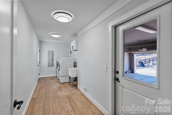 a view of empty room with wooden floor