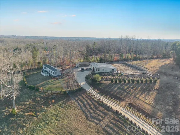 a view of a backyard with sitting area