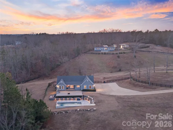 an aerial view of a house with a garden