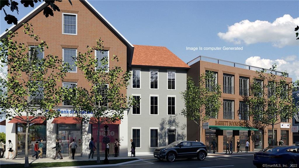 a car parked in front of white building