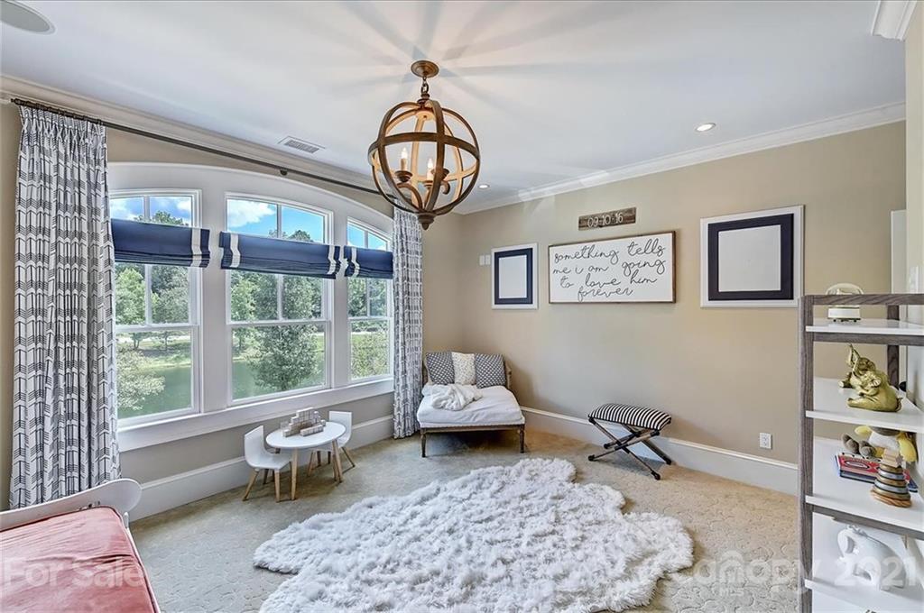 3211 Trinity Church Road Concord, NC 28027 - Photo 34 of 48 a living room with furniture a rug and a large window