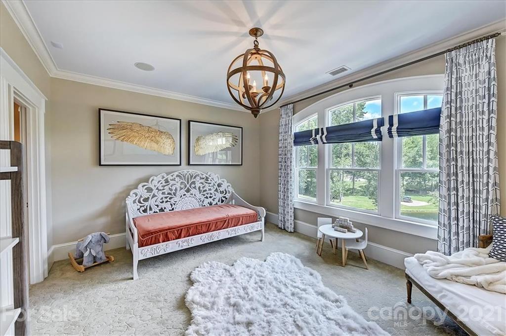 3211 Trinity Church Road Concord, NC 28027 - Photo 35 of 48 a bedroom with a bed and a table in it