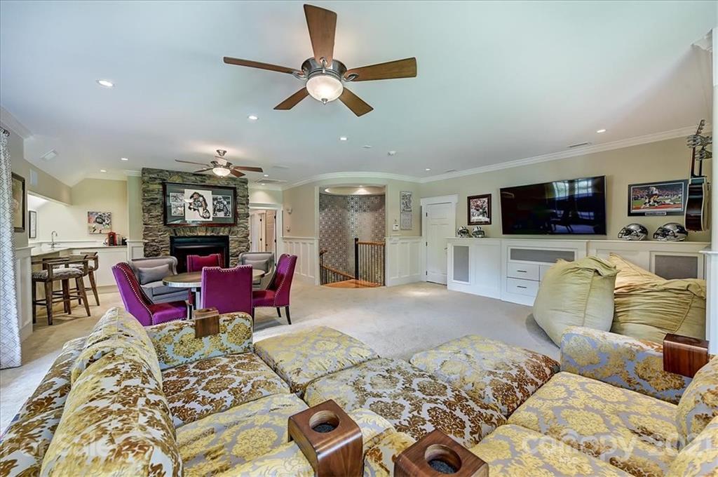 3211 Trinity Church Road Concord, NC 28027 - Photo 39 of 48 a living room with furniture kitchen view and a flat screen tv