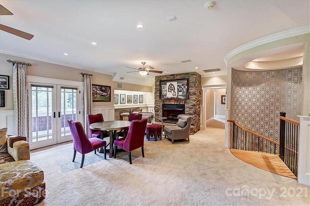 3211 Trinity Church Road Concord, NC 28027 - Photo 42 of 48 a living room with furniture and a fireplace