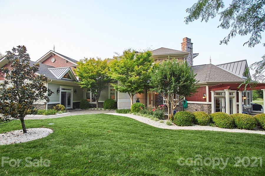 3211 Trinity Church Road Concord, NC 28027 - Photo 6 of 48 a front view of a house with a yard and trees