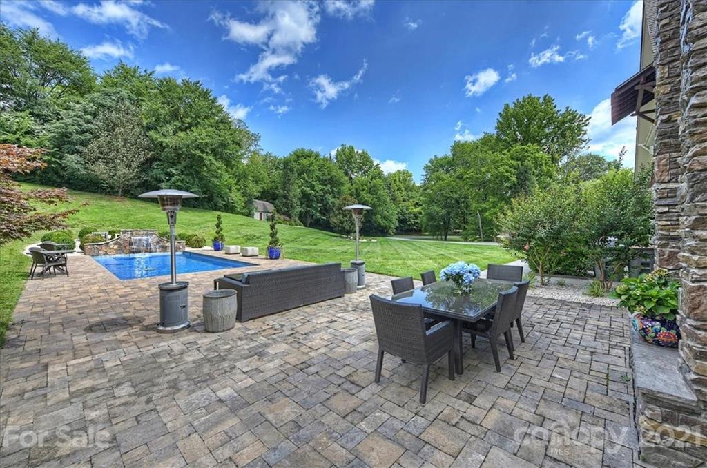 3211 Trinity Church Road Concord, NC 28027 - Photo 8 of 48 a view of a patio with table and chairs potted plants with wooden fence