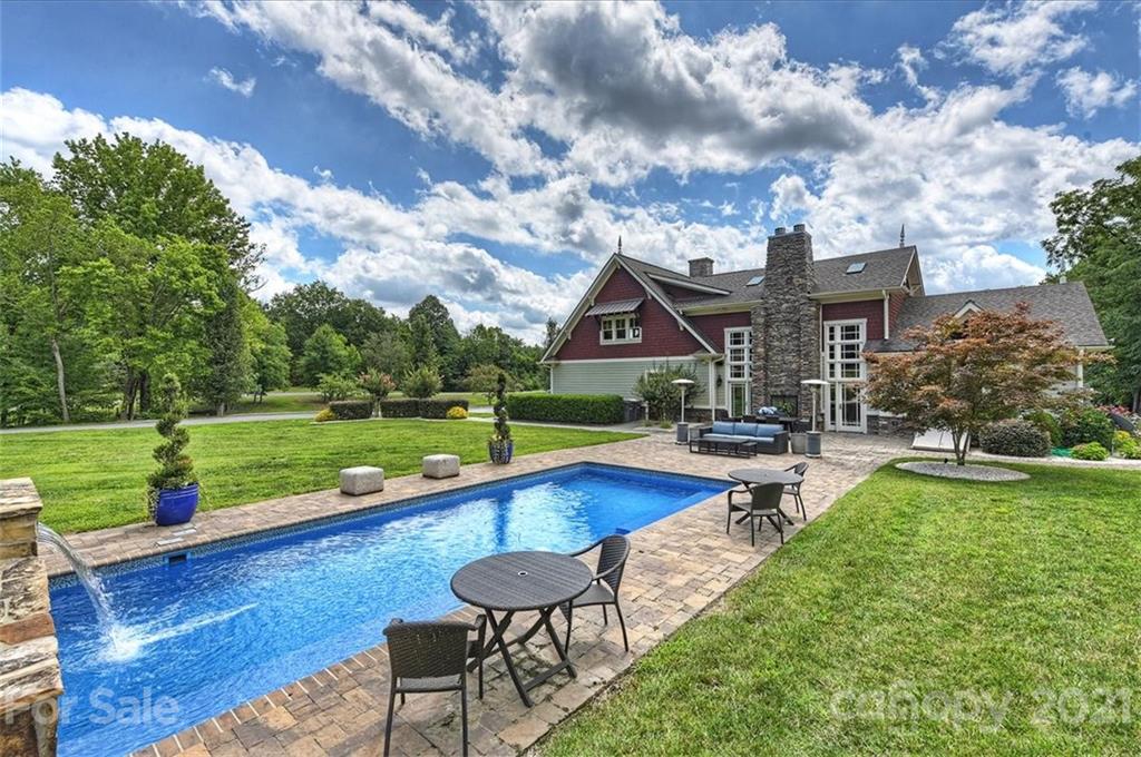 3211 Trinity Church Road Concord, NC 28027 - Photo 9 of 48 a view of a house with swimming pool and a yard