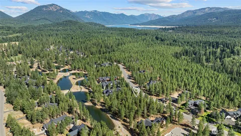 a view of a lush green hillside and houses