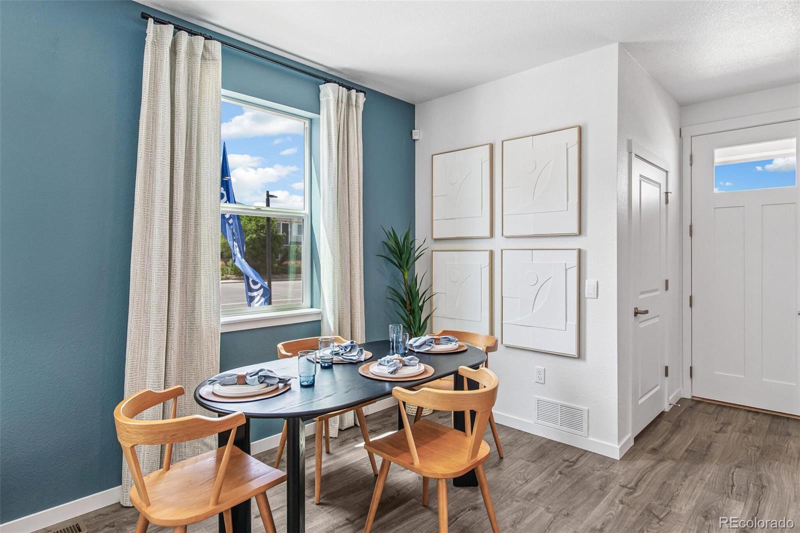 1389 South Chester Street, Unit A Denver, CO 80247 - Photo 14 of 30 a view of a dining room with furniture and window