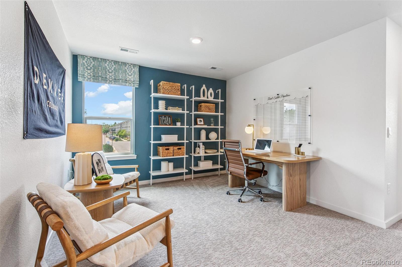 1389 South Chester Street, Unit A Denver, CO 80247 - Photo 17 of 30 a view of a workspace with furniture