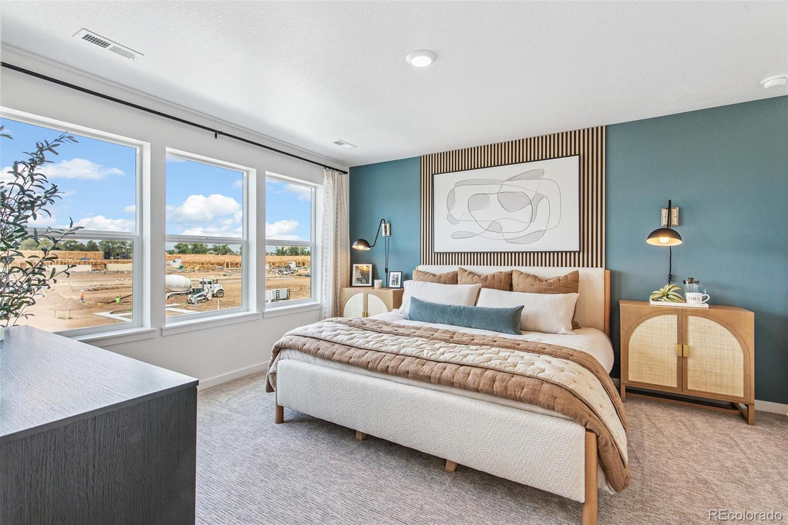 1389 South Chester Street, Unit A Denver, CO 80247 - Photo 20 of 30 a spacious bedroom with a large bed and a large window