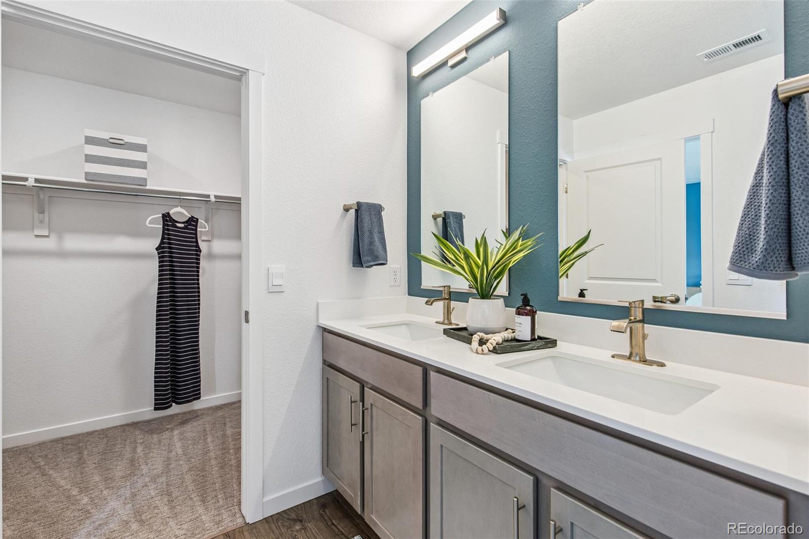 1389 South Chester Street, Unit A Denver, CO 80247 - Photo 23 of 30 a bathroom with a sink and a mirror