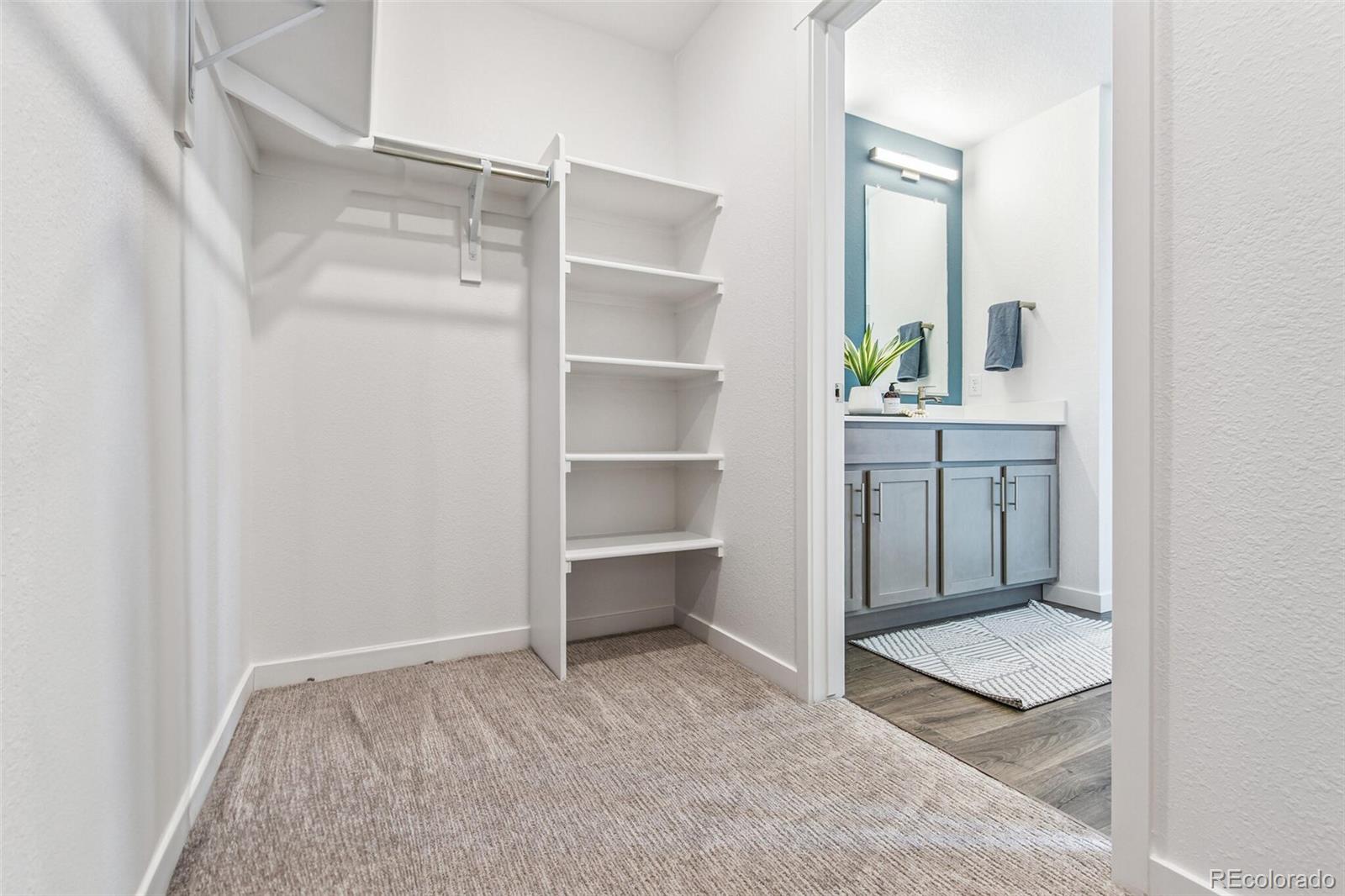 1389 South Chester Street, Unit A Denver, CO 80247 - Photo 24 of 30 a view of workspace and bathroom