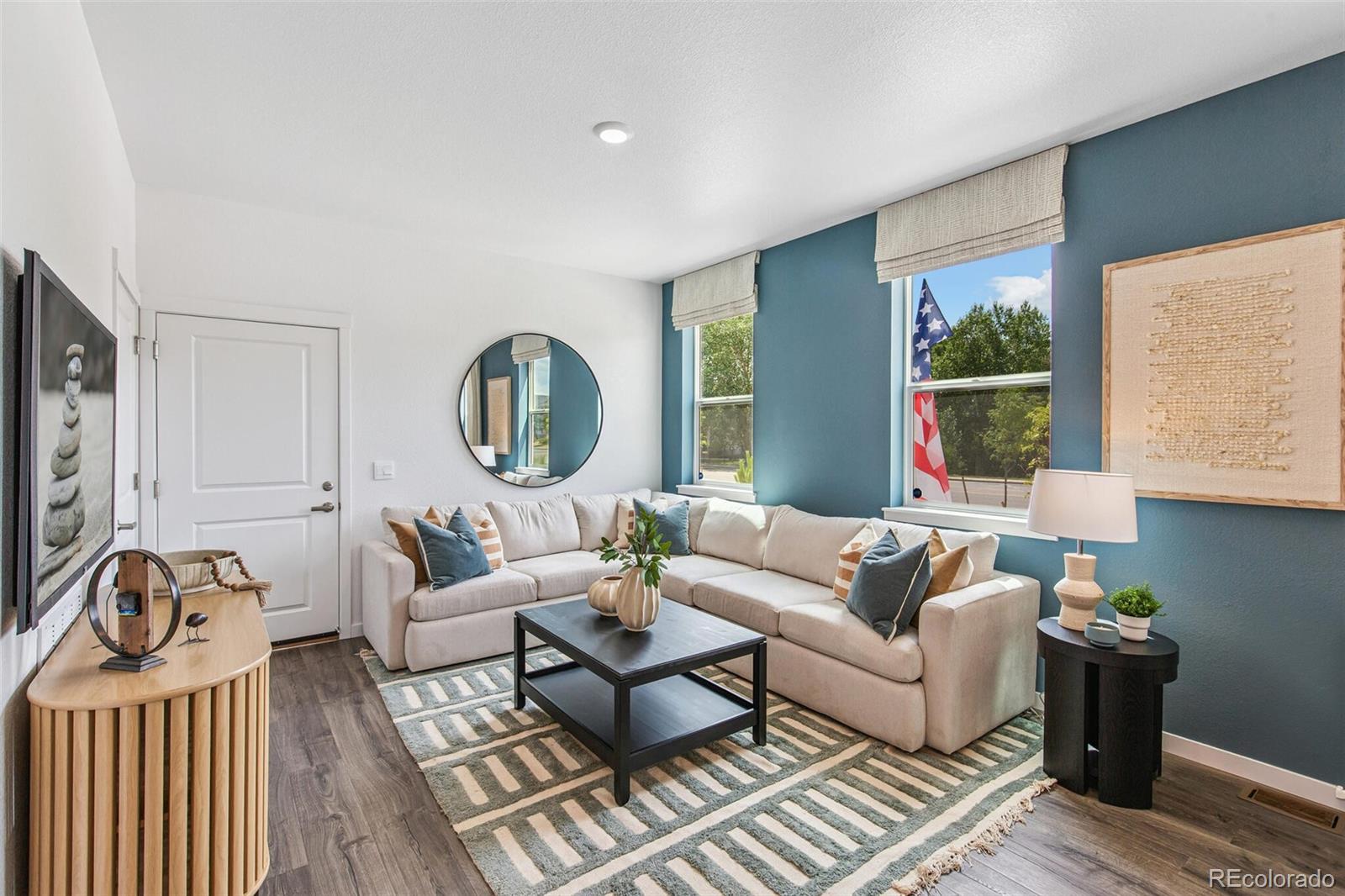1389 South Chester Street, Unit A Denver, CO 80247 - Photo 6 of 30 a living room with furniture rug and window