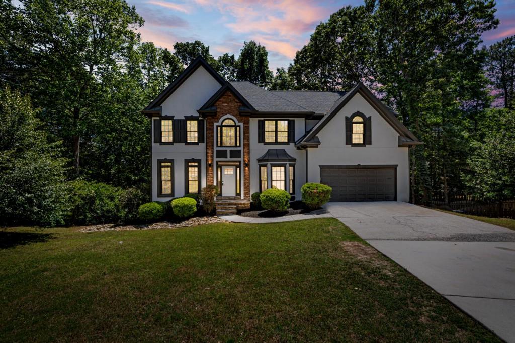 a front view of a house with a yard
