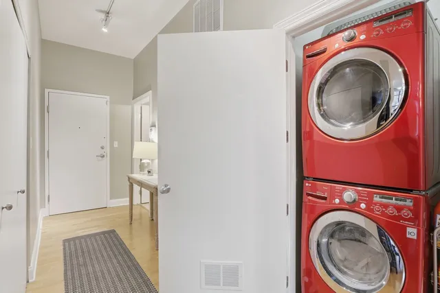 a close view of a utility room with dryer and washer