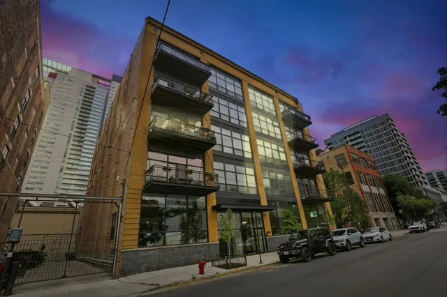 a view of a street with cars on the road