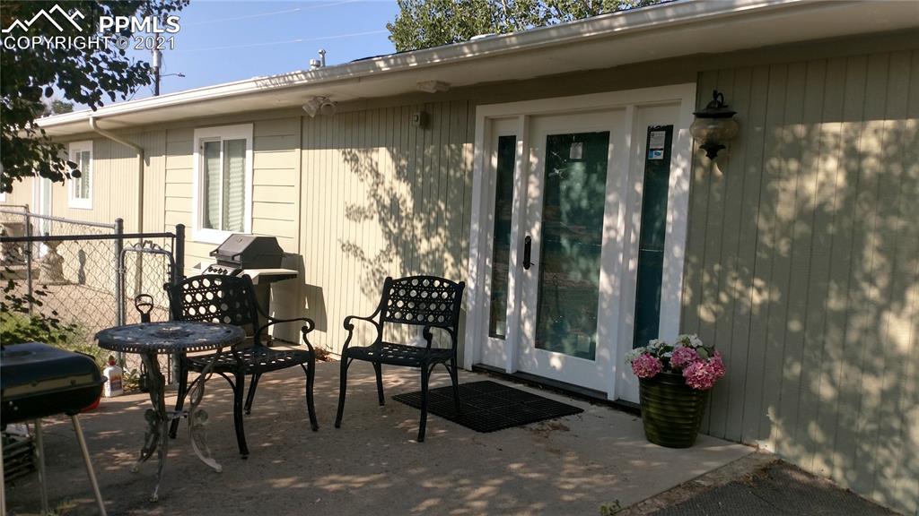 476 Elbert Street Elizabeth, CO 80107 - Photo 11 of 16 a view of two chairs and table in the patio