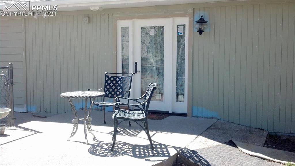 476 Elbert Street Elizabeth, CO 80107 - Photo 12 of 16 a dining room with furniture and wooden floor