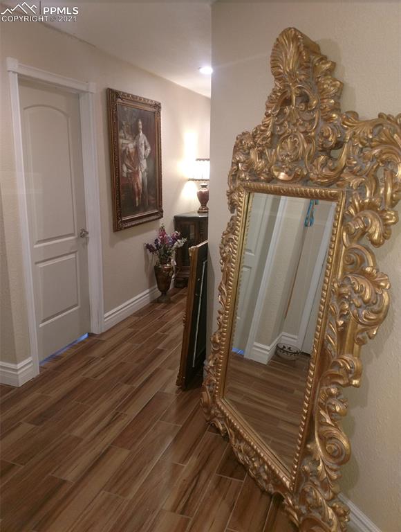 476 Elbert Street Elizabeth, CO 80107 - Photo 10 of 16 a view of a hallway with wooden floor
