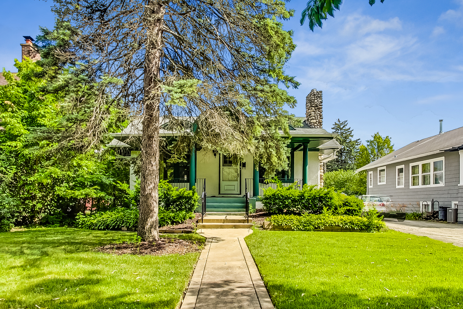 225 Herrick Road Riverside, IL 60546 - Photo 1 of 42 a front view of a house with garden